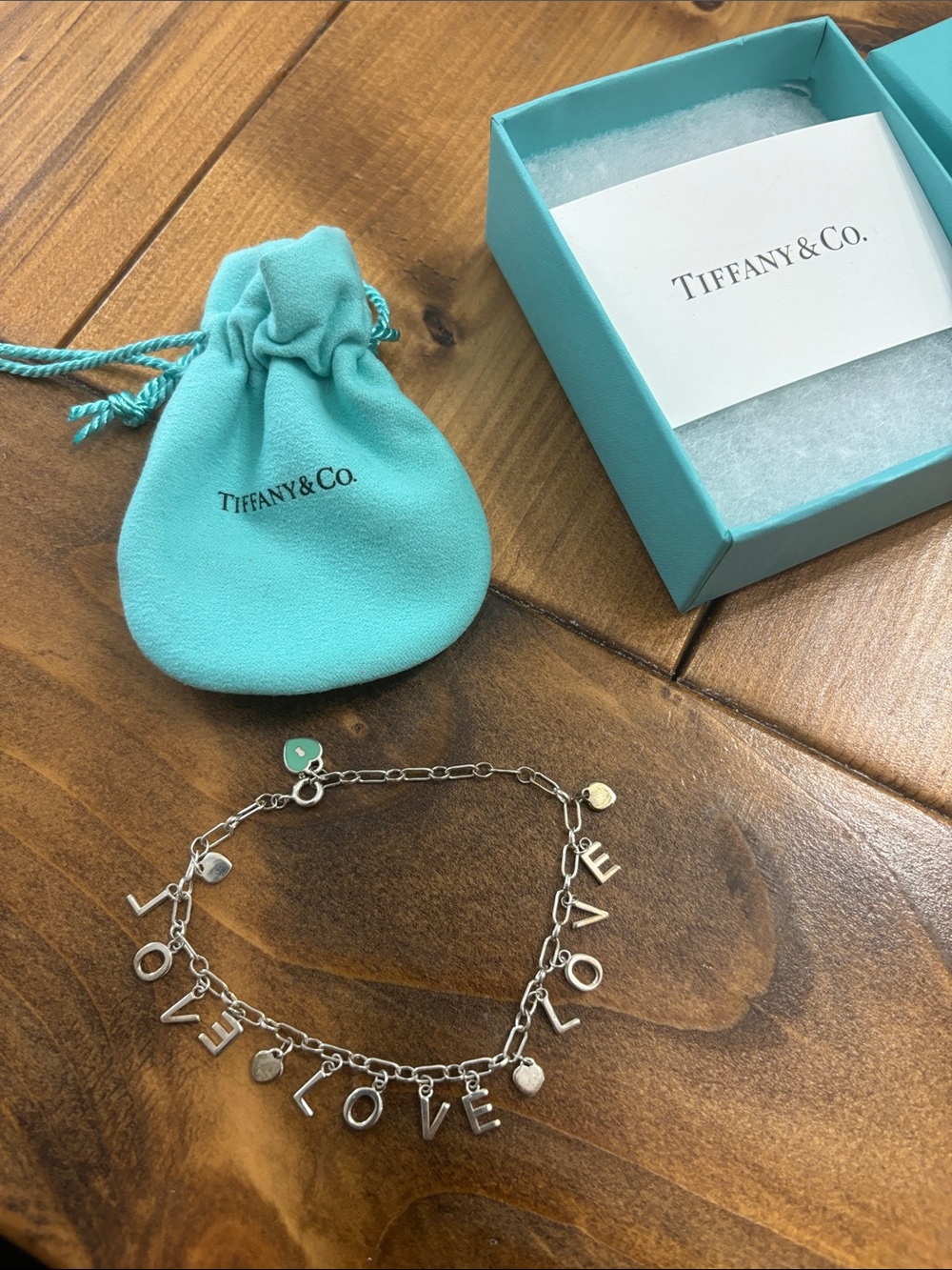 Tiffany & Co. Silver 'LOVE' Charm Bracelet with Signature Blue Pouch